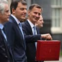 Britain’s Chancellor of the Exchequer Jeremy Hunt poses with the red Budget Box as he leaves 11 Downing Street in central London on March 15, 2023, to present the government’s annual budget to Parliament. (Photo by JUSTIN TALLIS / AFP) (Photo by JUSTIN TALLIS/AFP via Getty Images)