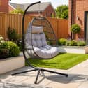 The stylish dark grey hanging egg chair could become the standout feature in any patio or garden setting