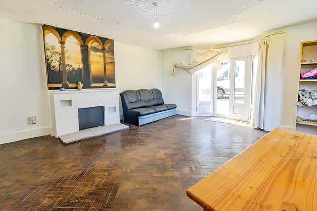 The bright lounge offer character and doors leading the garden