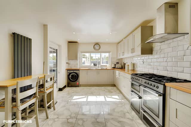 The separate kitchen forms part of the home's refurbished accommodation, alongside the living room, dining room and flexible family room.