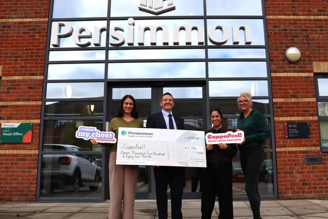 Managing Director for Persimmon Homes Midlands, David Ablett, presenting the cheque to CoppaFeel!.