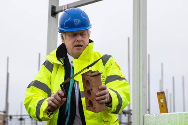 Boris trying a spot of bricklaying