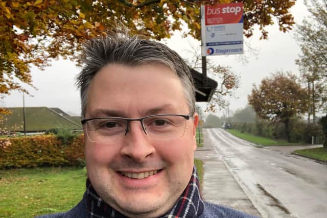 Daniel Norton at one of the rural bus stops in Bedford