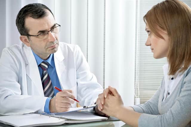 A GP talking to a patient