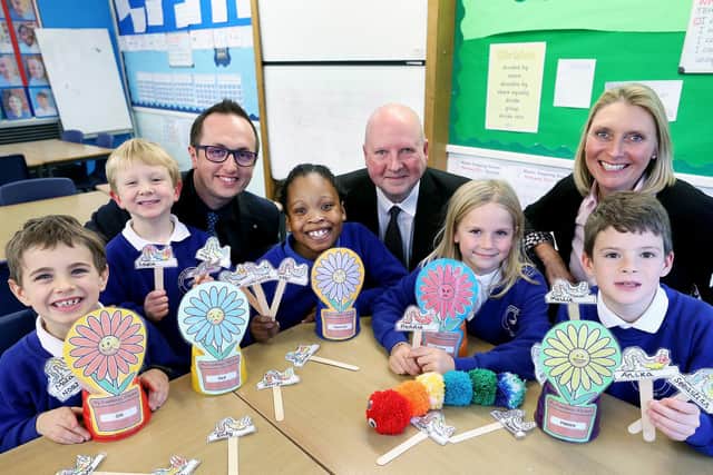 L to R: Headteacher Joseph Piatczanyn, CALA Homes' Patrick Danagher and Elizabeth Fordham (Mind Map Charity) with Niko (7), James (4), Maya (9), Imogen (8) and Euan (8). Photo by Tim George