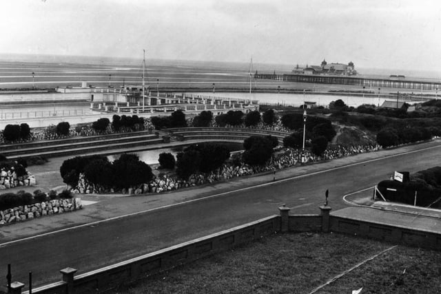 A deserted view of St Annes promenade in November 1961, showing the Pier with its Moorish Pavilion and Floral Hall, both later destroyed by fire. In the foreground is the ampitheatre a popular venue for shows until it was given over for use as a children's paddling pool. Behind stands the Open Air Baths.
historical