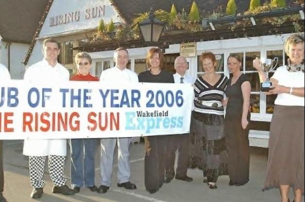 Maureen Madeley with the trophy and her staff at Castleford's Rising Sun after winning the Express Pub of Year in 200