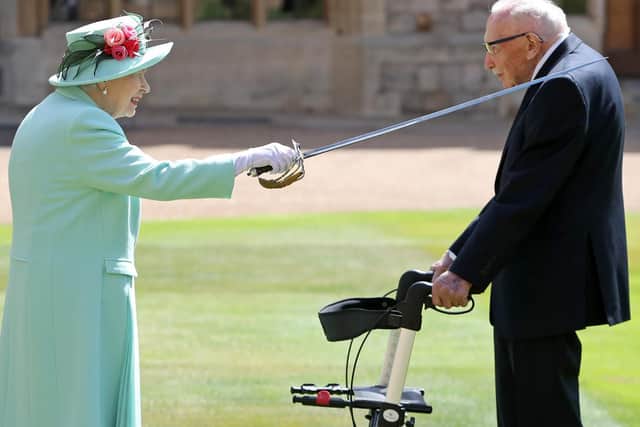 The Queen awards Captain Sir Tom Moore with the insignia of Knight Bachelor at Windsor Castle (Photo by Chris Jackson)