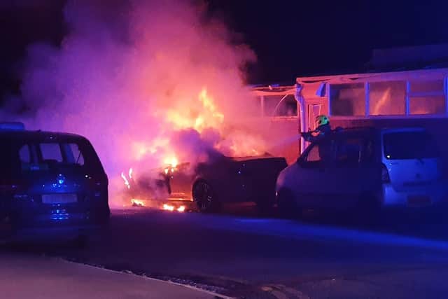 The fire engulfed 100 per cent of one car