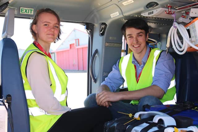Richard Woolmer pictured with Amy in the helicopter
