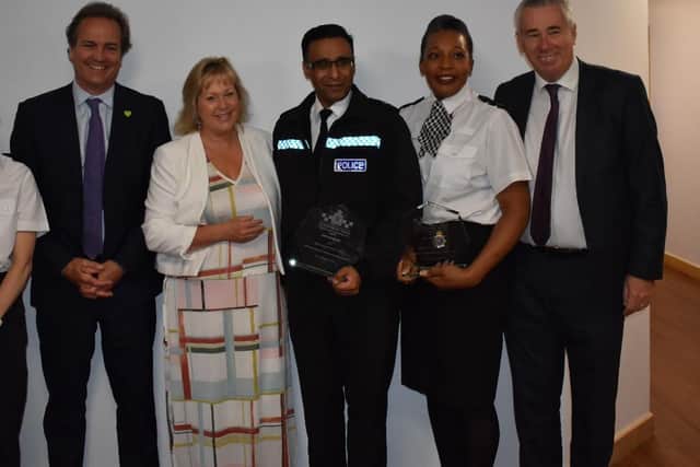 PC Ruth Honegan (is pictured second right) and Chief Inspector Mo Aziz (is pictured third right)