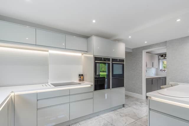 The kitchen is well equipped with a full range of units, Corian work surfaces and integrated appliances.