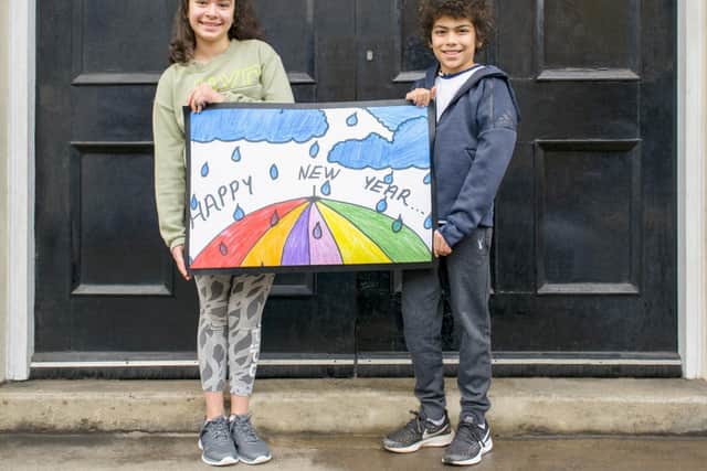 Erdi and his sister Duru with the winning mat design
