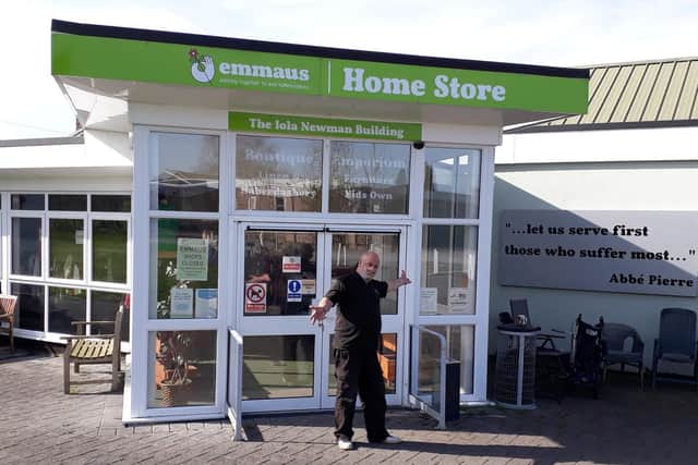 Tony, one of the formerly homeless people being supported by the charity, in front of the Emmaus Village Carlton Home Store