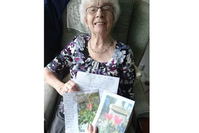 Home Instead clients with letters and flowers to help brighten their day