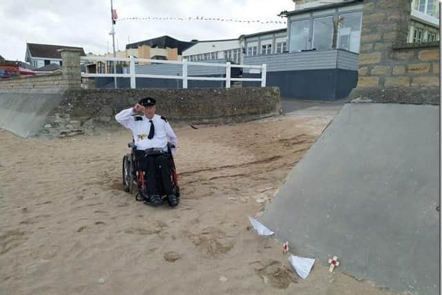 George saluting two World War Two veteran's who landed on Sword Beach in France