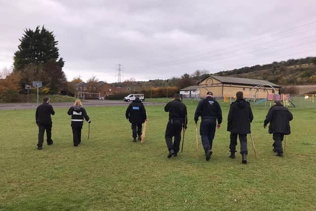 Bedfordshire Police officers carrying out a weapons sweep
