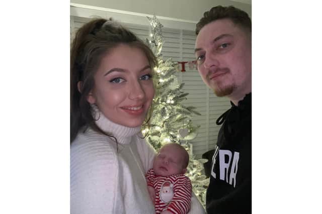 Tasha and Adam with baby Alfie at Christmas