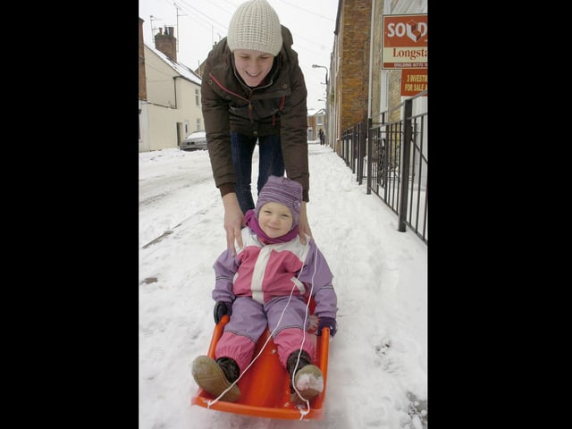 Dace Apine, pushing her daughter Melisa, three.