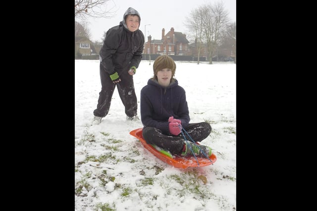 Brady Leary,10, and Jake Hall, 14, sledging in Woodville Road park.