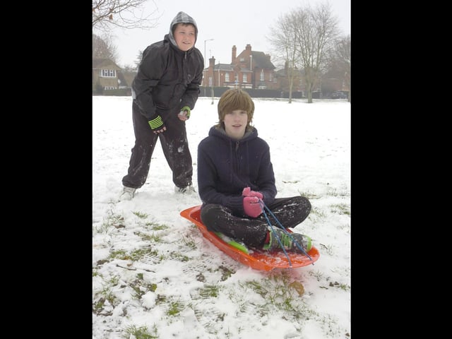 Brady Leary,10, and Jake Hall, 14, sledging in Woodville Road park.