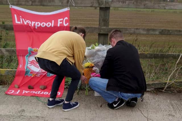 Tributes left following the collision PIC: SWNS