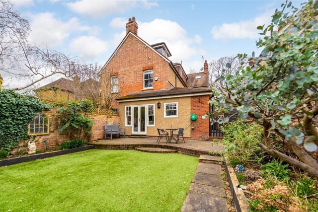A gated side access leads to the rear garden which has been landscaped for easy maintenance. It has a raised paved area directly off the study and an artificial lawn with established borders
