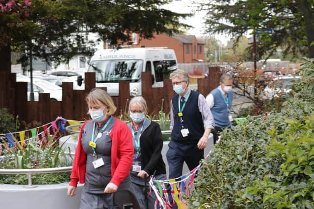 Hospital staff walked 100 laps of the landscaped Captain Sir Thomas and Pamela Moore Gardens