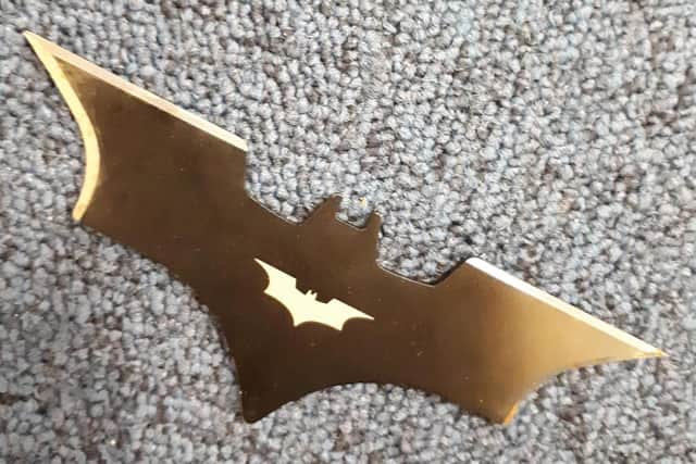 A modified throwing star shaped like Batman's batarang was found in a residential garden