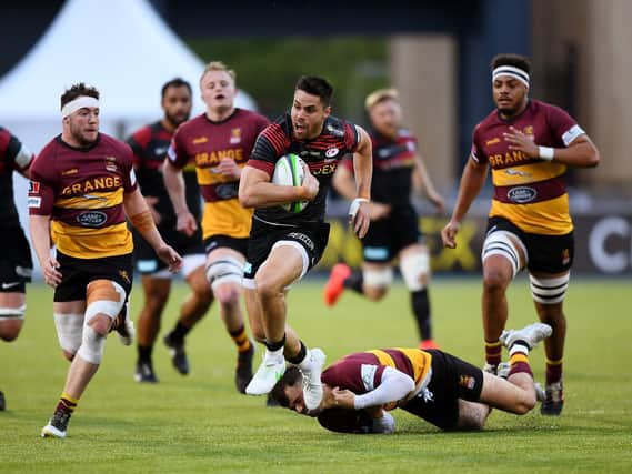 Ampthill in pursuit of Saracens' Sean Maitland in Monday's game (Picture Alex Davidson/Getty Images)