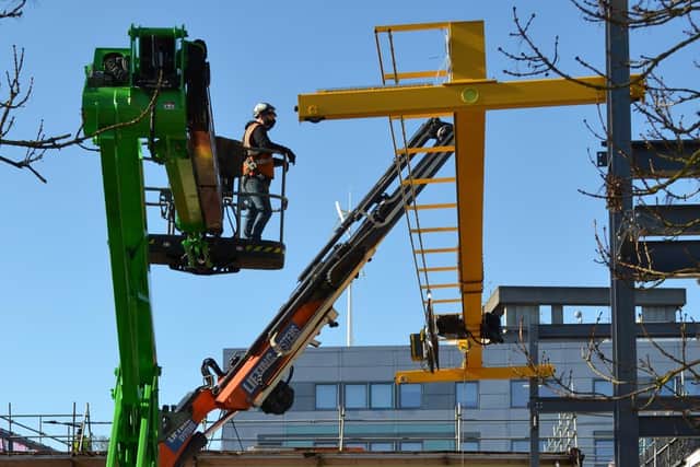 A gantry crane being moved into the newly refurbished block