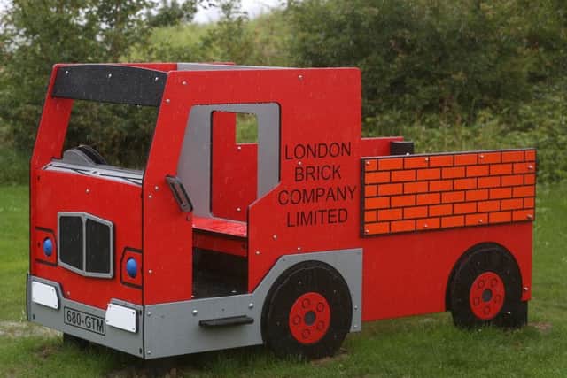 The branded London Brick Company truck in the play area
