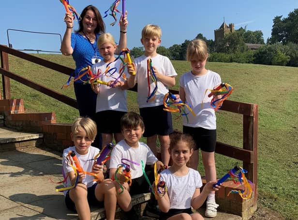 Maulden Lower School pupils and headteacher, Kathy Dwyer, with sporting equipment donated by Mulberry Homes