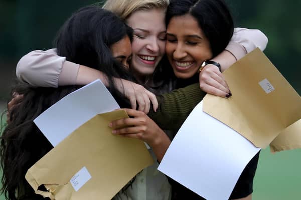 Students celebrate after getting their GCSE results