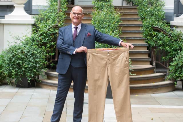Ken McLeod with a pair of his old trousers