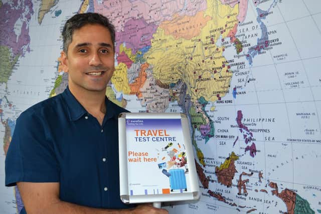 Meherwan Bozorgi, owner of Global Travel Experts of Bedford