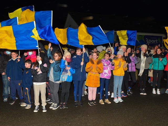 Supporters gather at Steelstown GAC for the homecoming of Derry, Ulster and All Ireland Intermediate Football Champions Brian Og’s on Monday evening. Photo: George Sweeney. DER2206GS – 078