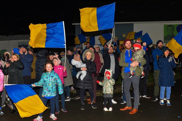 Families gather at Steelstown GAC for the homecoming of Derry, Ulster and All Ireland Intermediate Football Champions Brian Og’s on Monday evening.  Photo: George Sweeney.  DER2206GS – 077