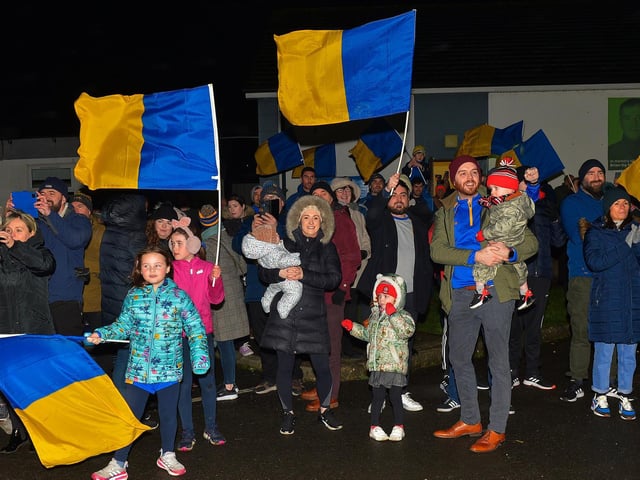 Families gather at Steelstown GAC for the homecoming of Derry, Ulster and All Ireland Intermediate Football Champions Brian Og’s on Monday evening. Photo: George Sweeney. DER2206GS – 077