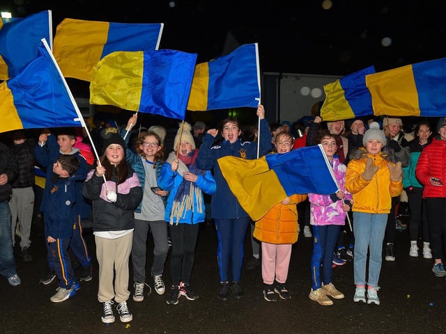Supporters gather at Steelstown GAC for the homecoming of Derry, Ulster and All Ireland Intermediate Football Champions Brian Og’s on Monday evening. Photo: George Sweeney. DER2206GS – 078