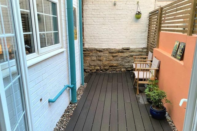 To the rear is small courtyard with timber decking and a gated side access from the neighbouring property