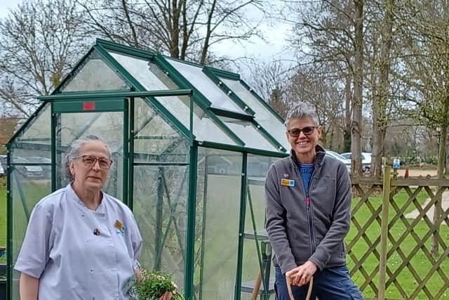 Hospice Chef Sandra Galton and gardening volunteer Debbie Brown in the kitchen garden