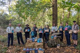 Scouts and leaders from Flitwick Scout Group presenting bird boxes to Manor Park Public Realm Team