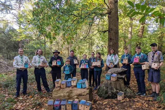 Scouts and leaders from Flitwick Scout Group presenting bird boxes to Manor Park Public Realm Team