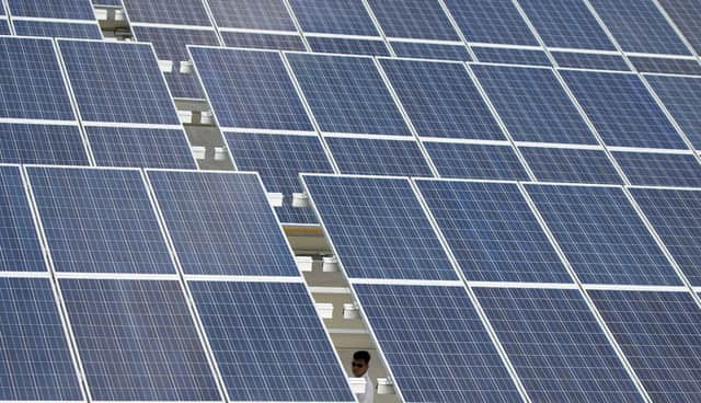 Close up of solar panels.   (Photo credit should read NOEL CELIS/AFP via Getty Images)