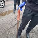 Police seized a sword during the raid in Brickhill
