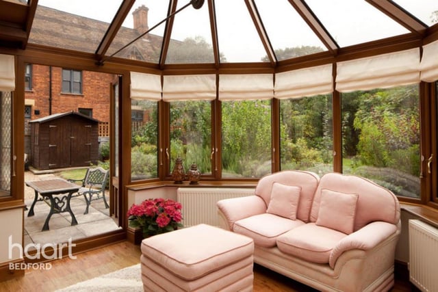 The conservatory is very spacious and affords views over the beautifully landscaped gardens