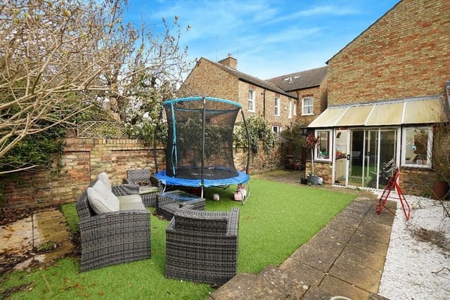 Outside, the westerly facing rear garden - which measures 31ft by 21ft - is walled with artificial grass and some planting