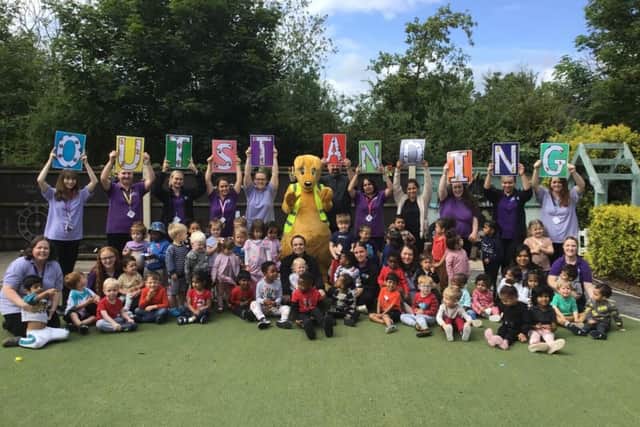 The children and team at Kiddi Caru Day Nursery in Bedford celebrating their ‘outstanding’ Ofsted rating