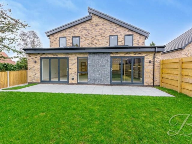 If you think the property looks attractive at the front, how about this view from the back? To the right is the kitchen hub and to the left, the lounge.